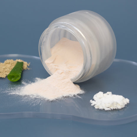 Container of Body Powder with a blue background and aloe vera