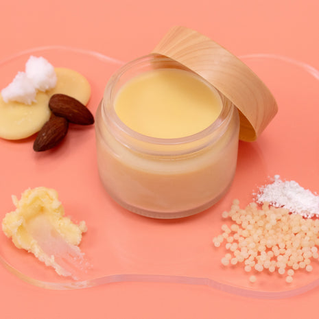 Jar of Deodorant with natural ingredients on a pink background